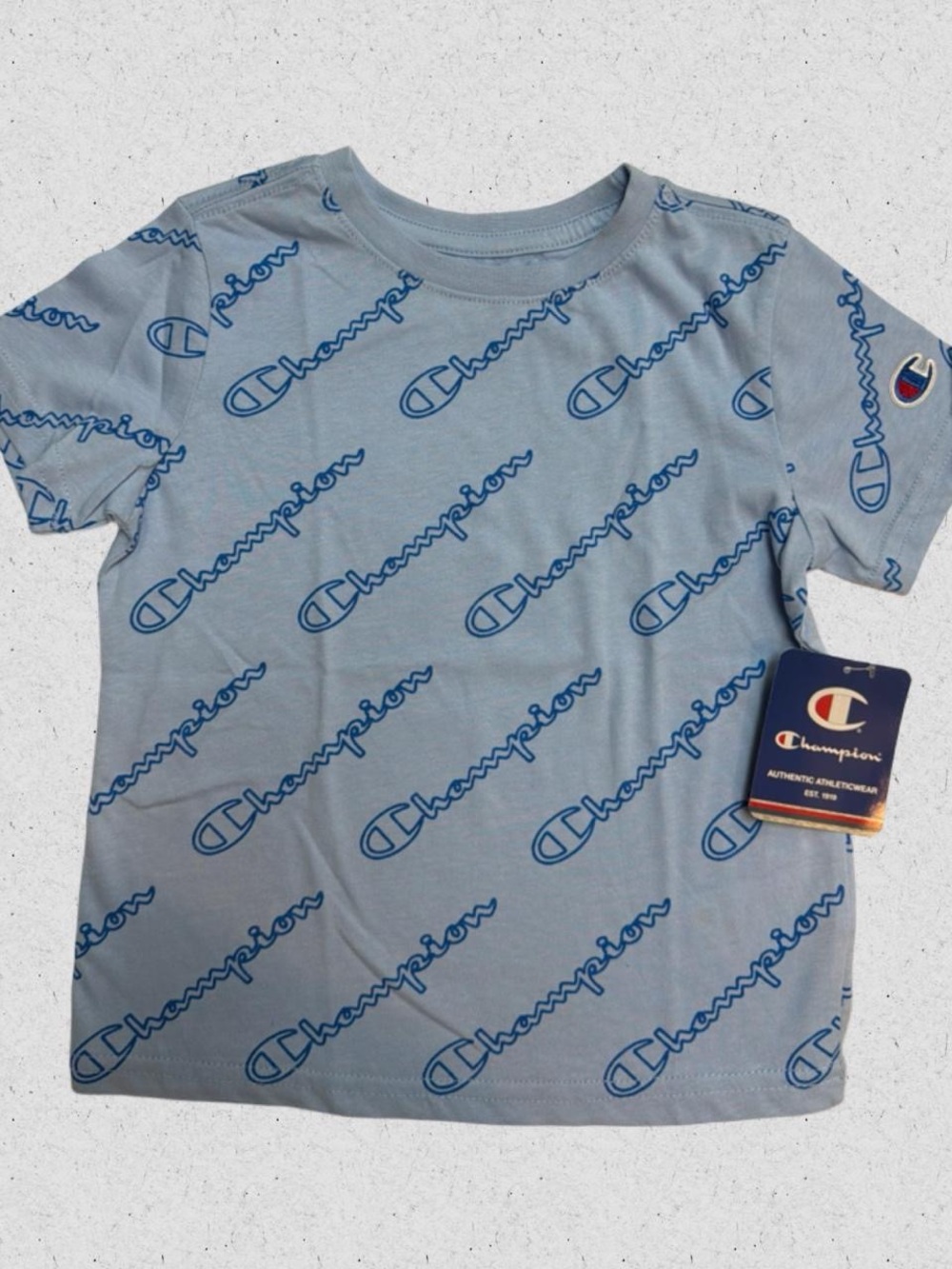 Champion Boy’s Light Blue Tee with Navy Allover Logo